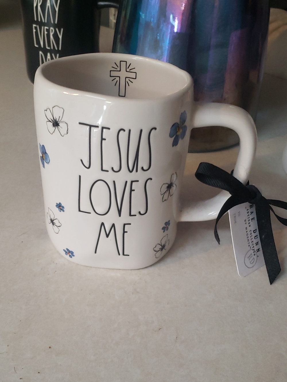 🦋Rae Dunn White Mug with Blue Floral Accents - "Jesus Loves Me"